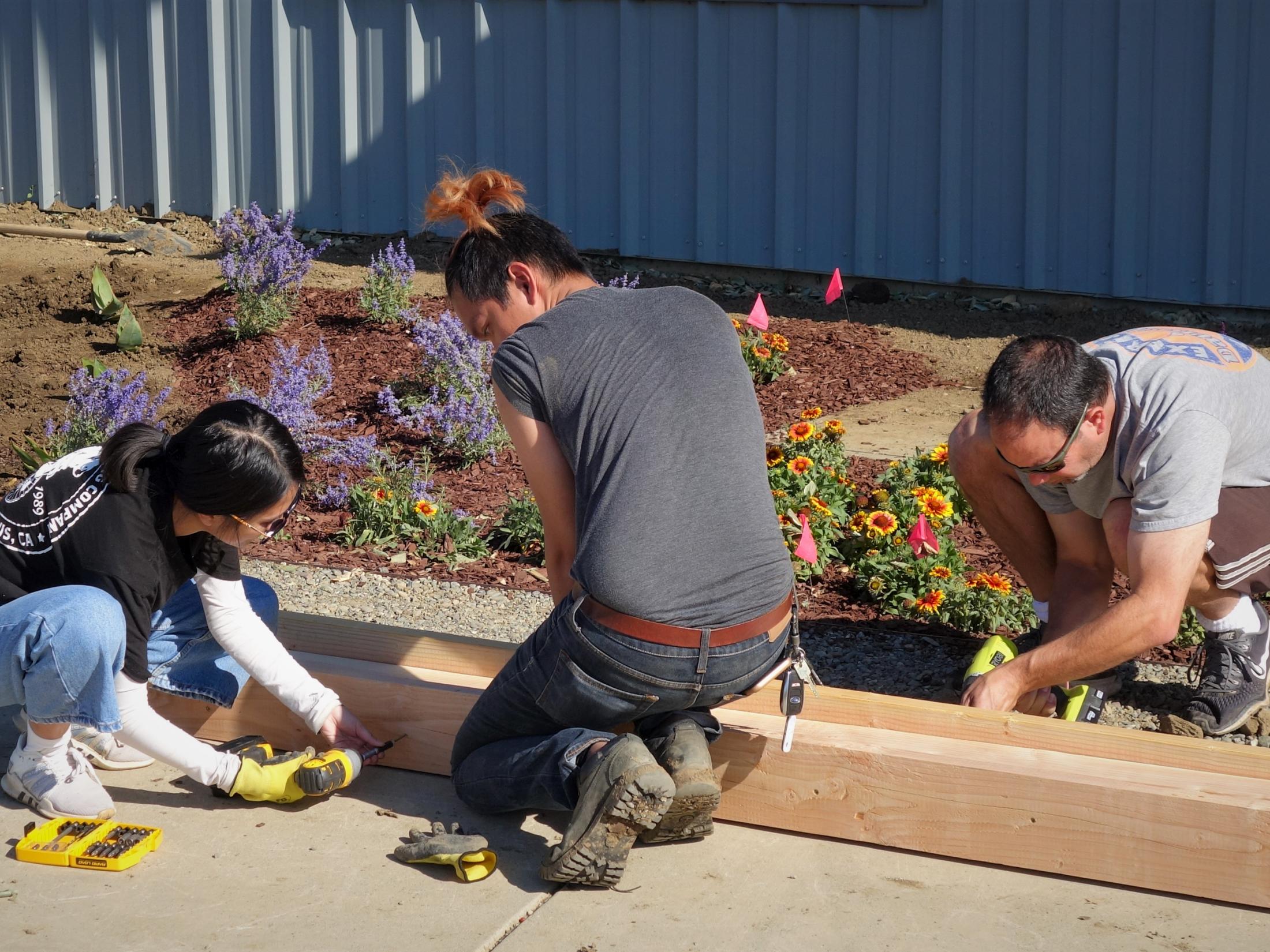 Students from the Student Leadership in Green Infrastructure club construct water drainways for Smartscape I